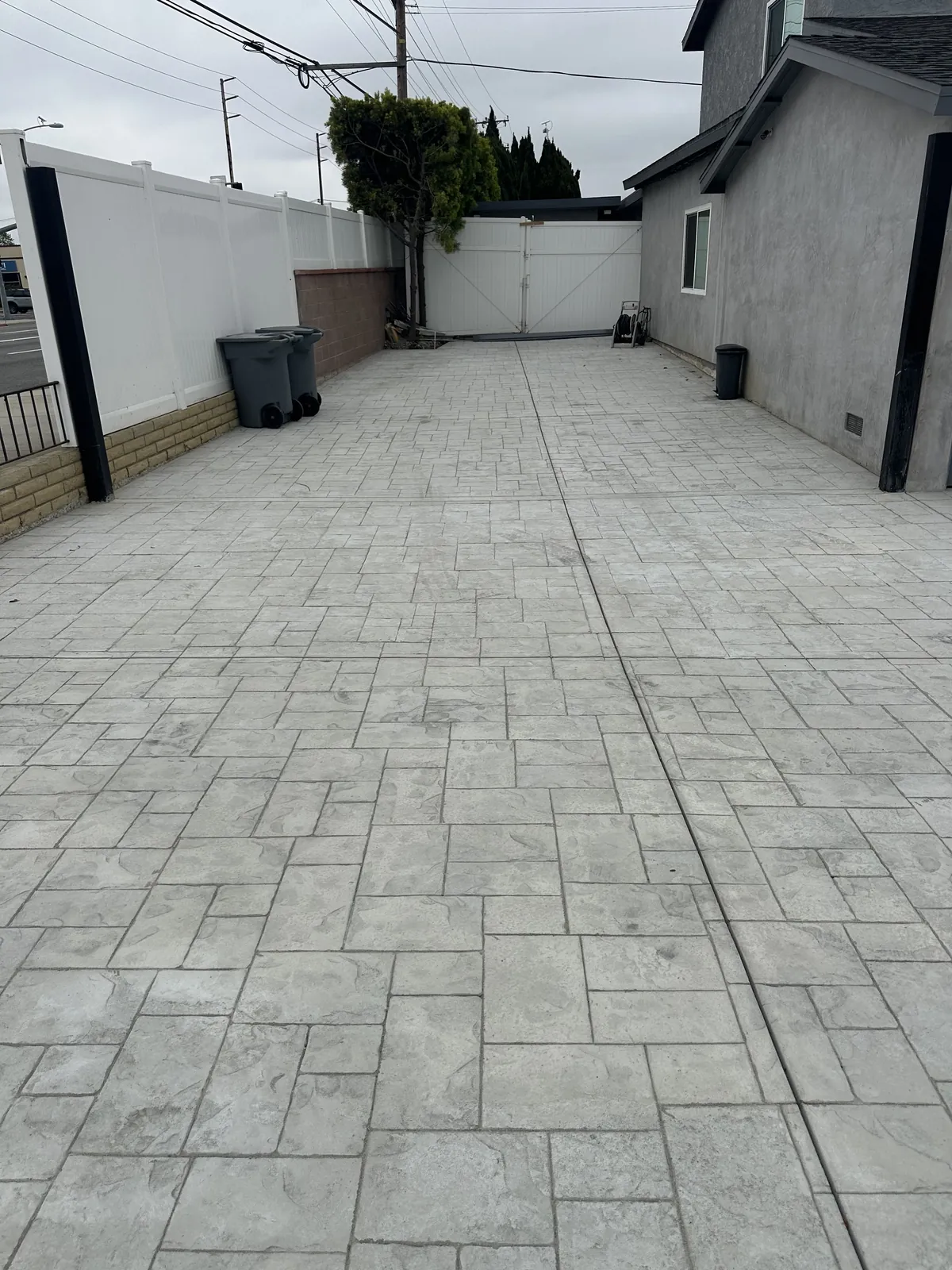 Stamped concrete driveway between two homes