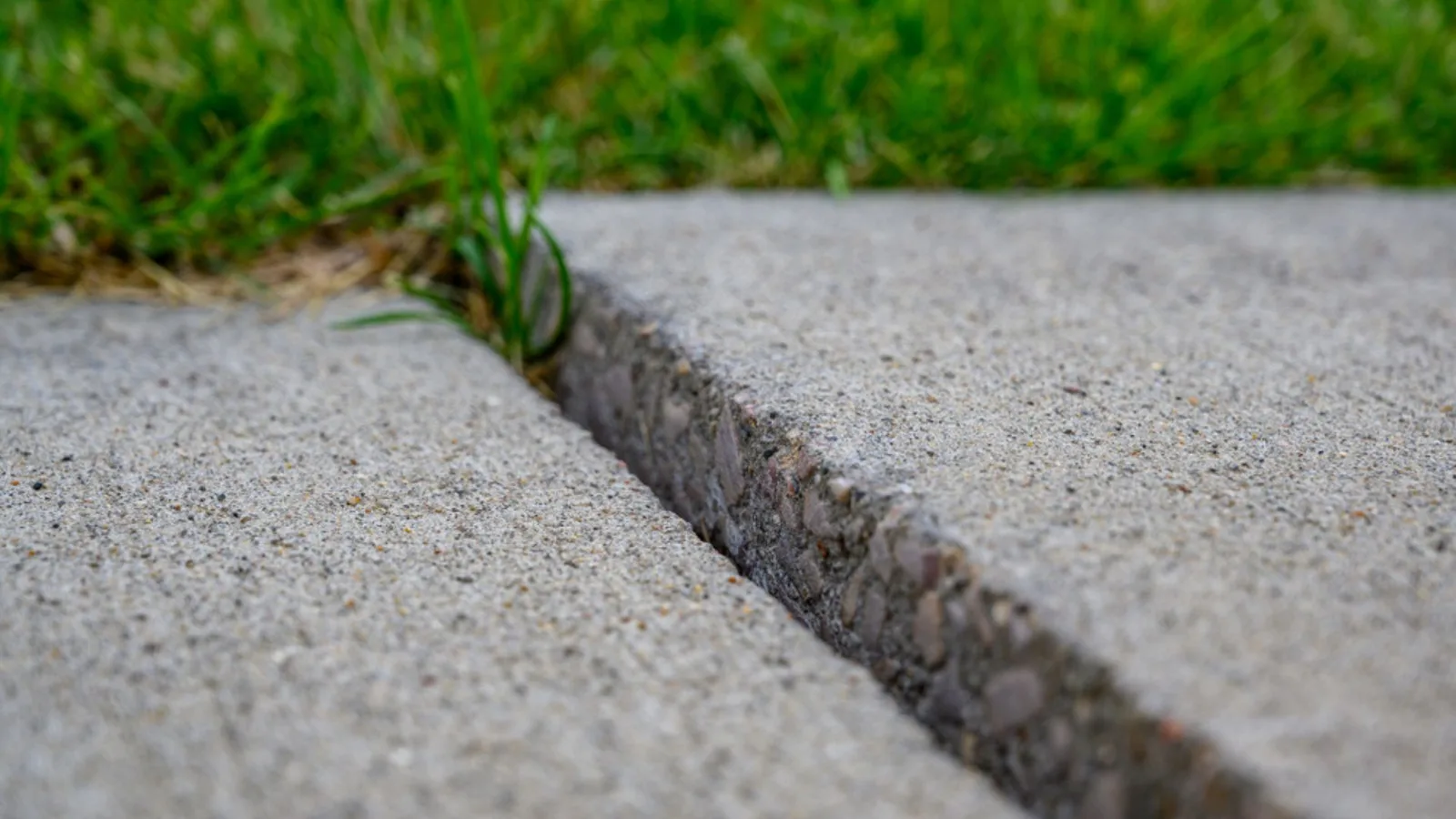 Settled concrete slab with a sunken edge — candidate for lifting